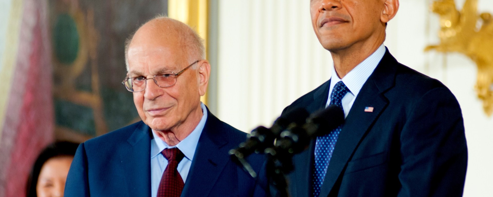 Barak Obama standing at a podium