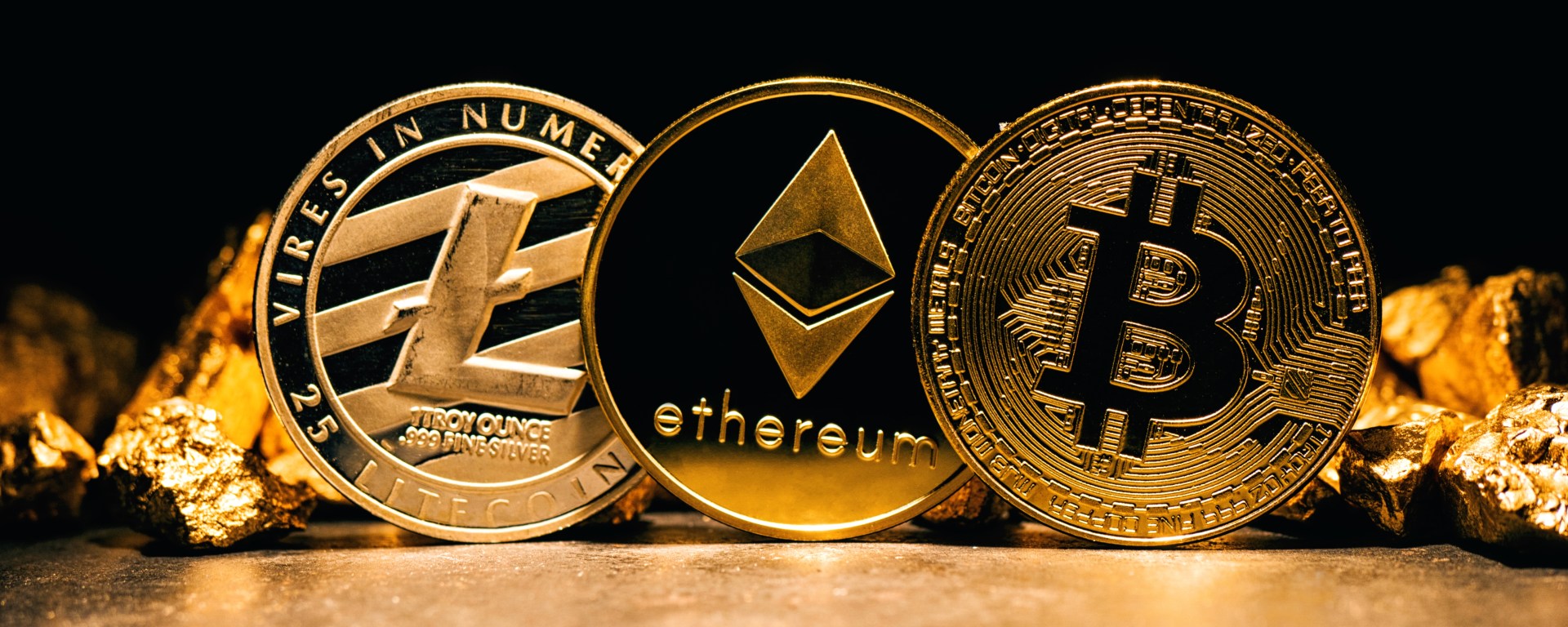 Coins made of gold and showing name Bitcoin, Ethereum, and Litecoin