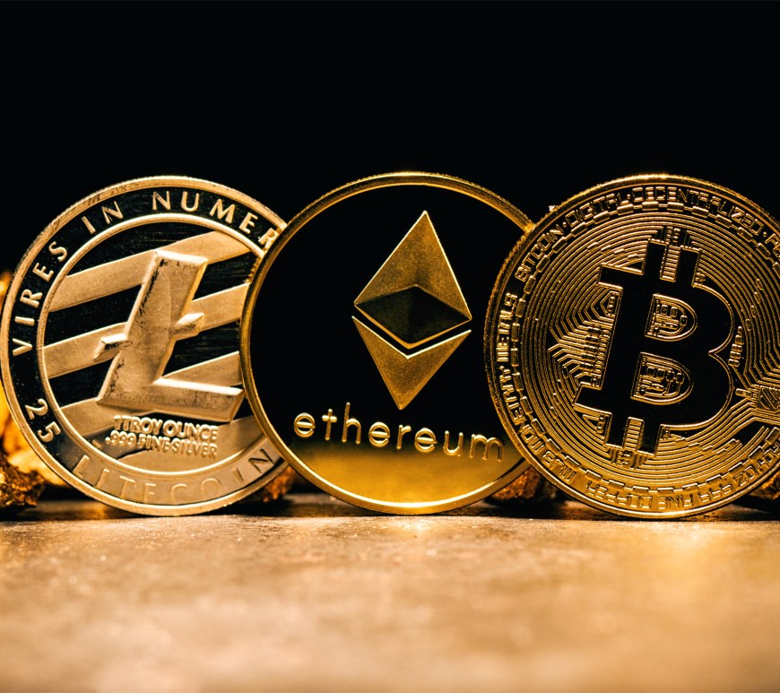 Coins made of gold and showing name Bitcoin, Ethereum, and Litecoin