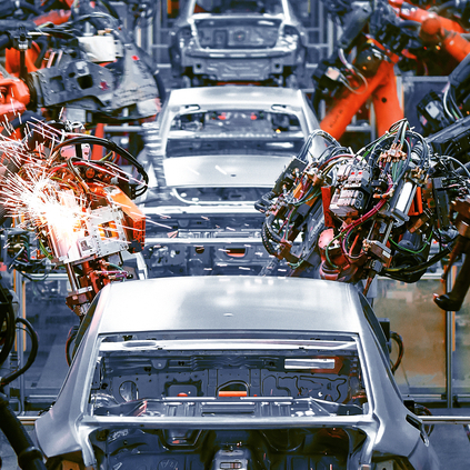 Car bodies being worked on by robots