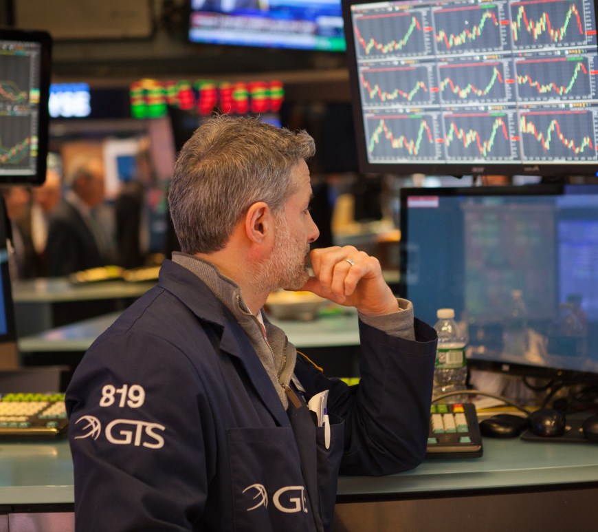 Stock broker watching screens