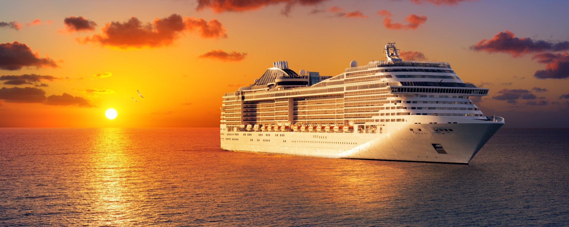 Cruise ship saling in the sunset